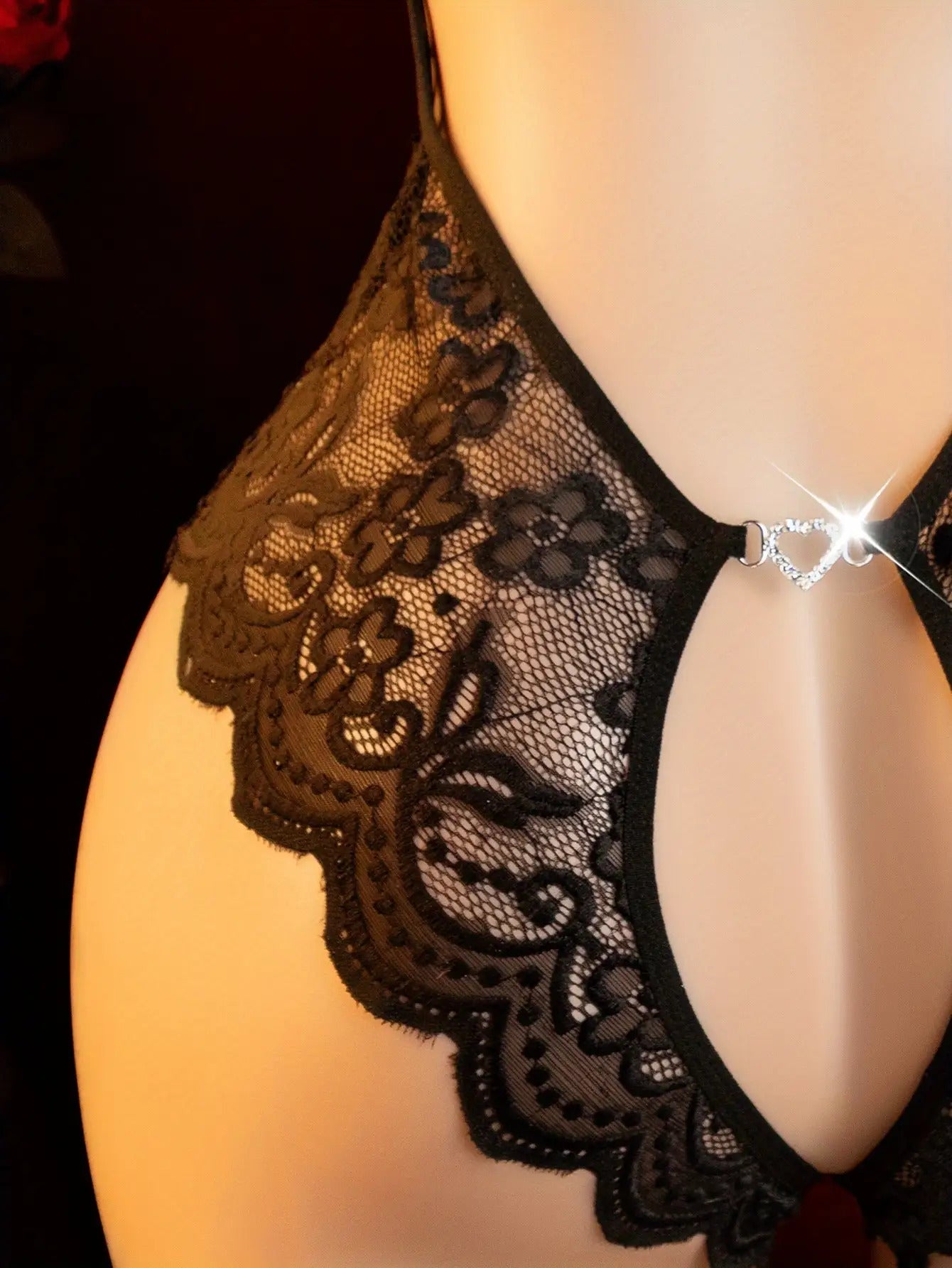 Seductive Lace Bodysuit with a V-Neck And Sheer Openings, Designed for Temptation. This New Sleepwear Is Perfect for Date Nights, Featuring a Daring Outfit That Showcases Exotic Allure. The Black Lingerie Includes Adjustable Straps And Floral Detail